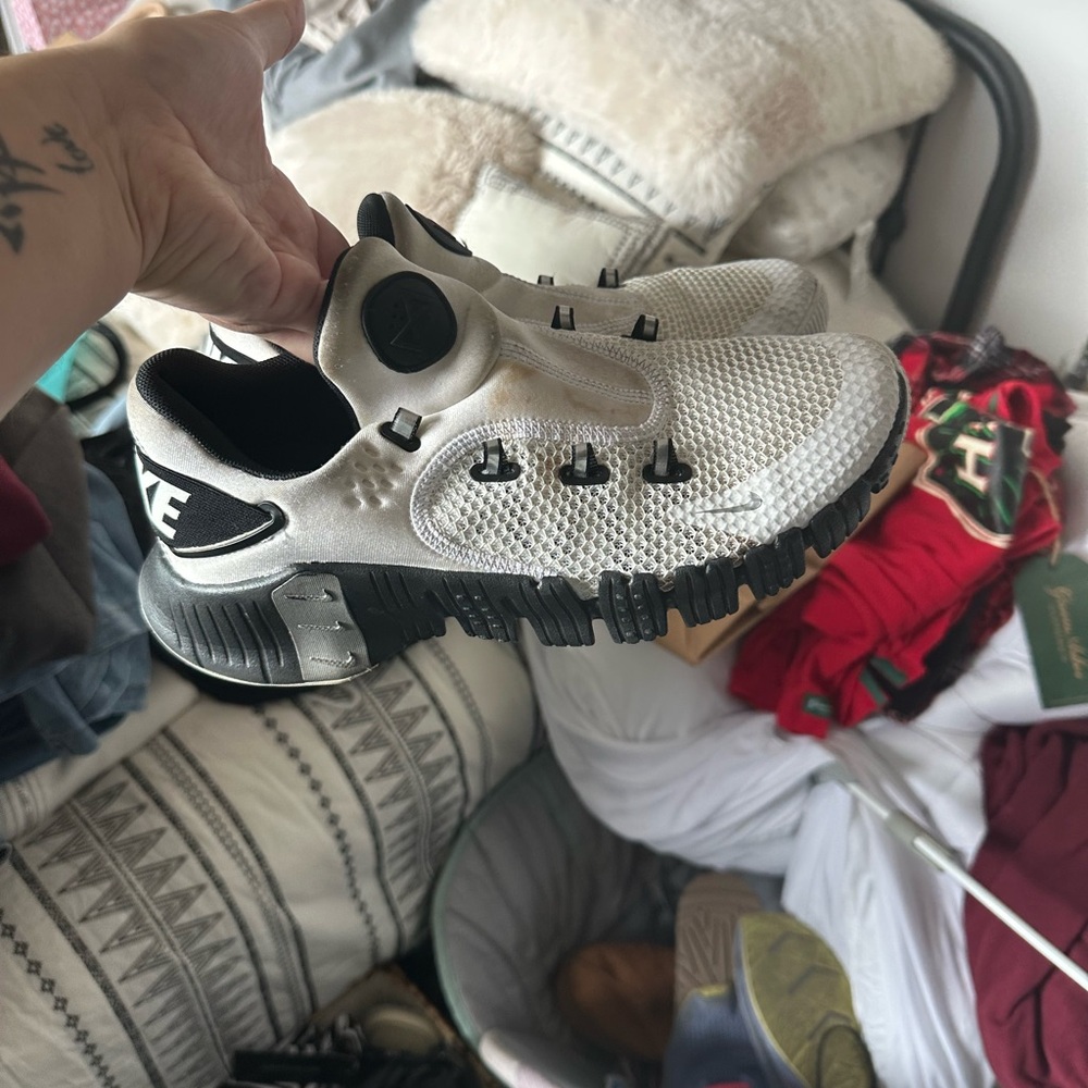 Nike women’s White and Black Slip-On Sneakers